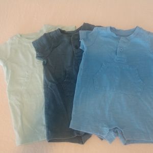 Primary Baby Rompers with pocket and buttons.